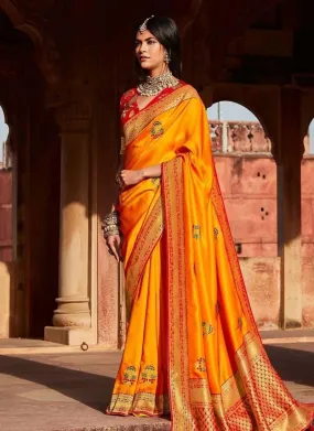 Astounding Orange color Silk Base Festival wear Silk Weave Saree